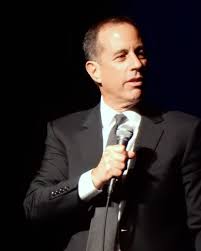 Jerry Seinfeld on stage. 